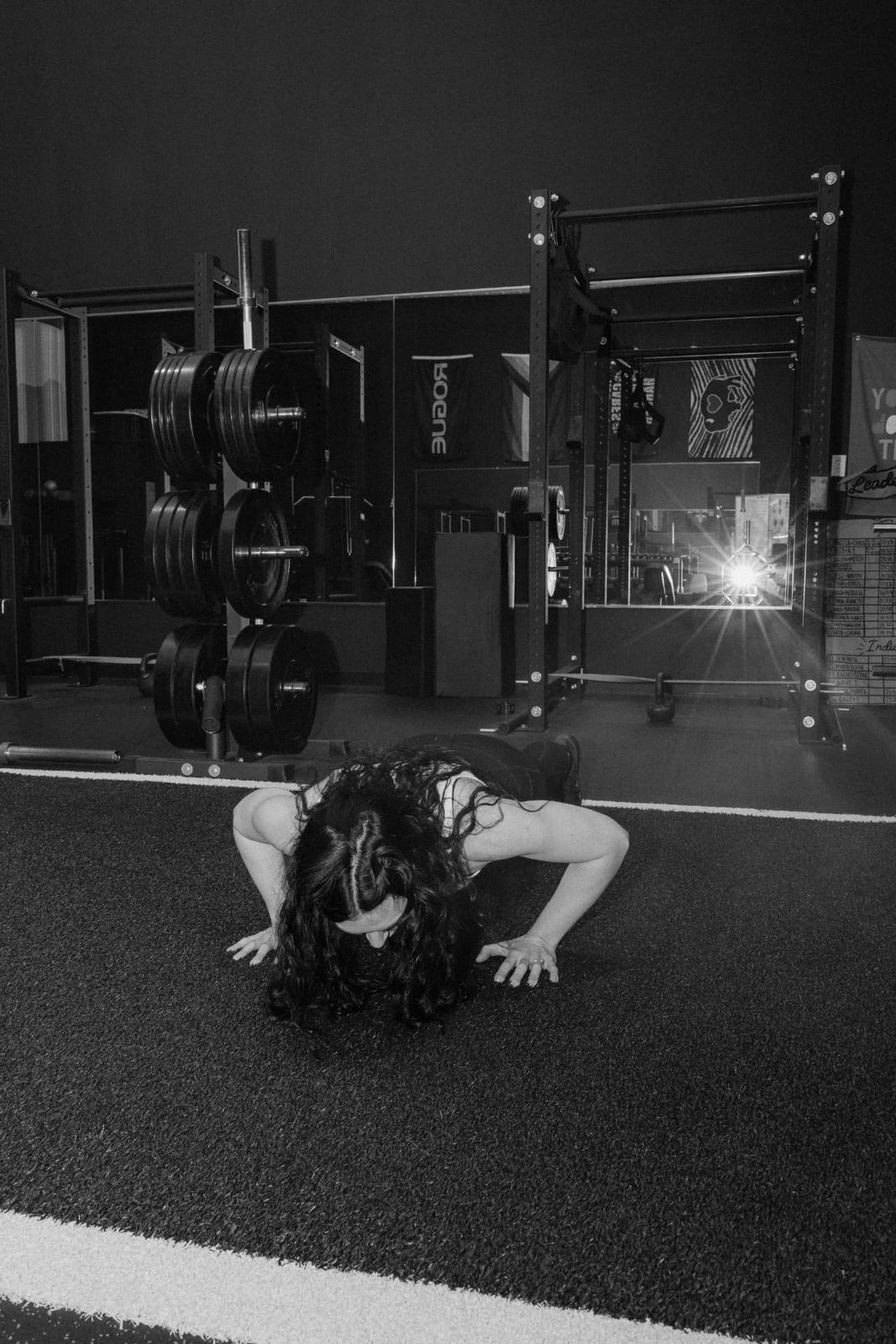Black and white photo of the turf and rack area at RockeyFit