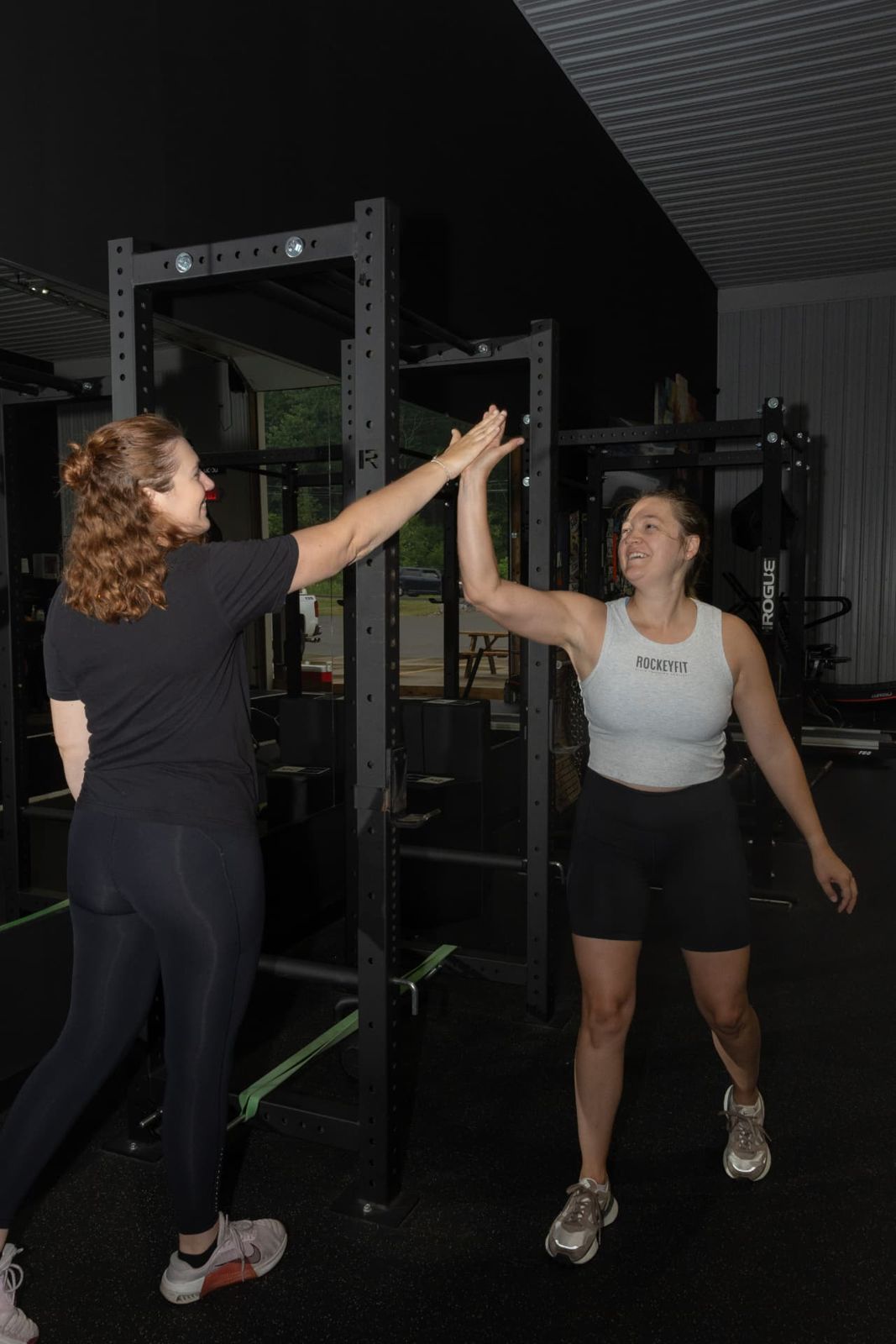 RockeyFit member high-fiving her coach after a session