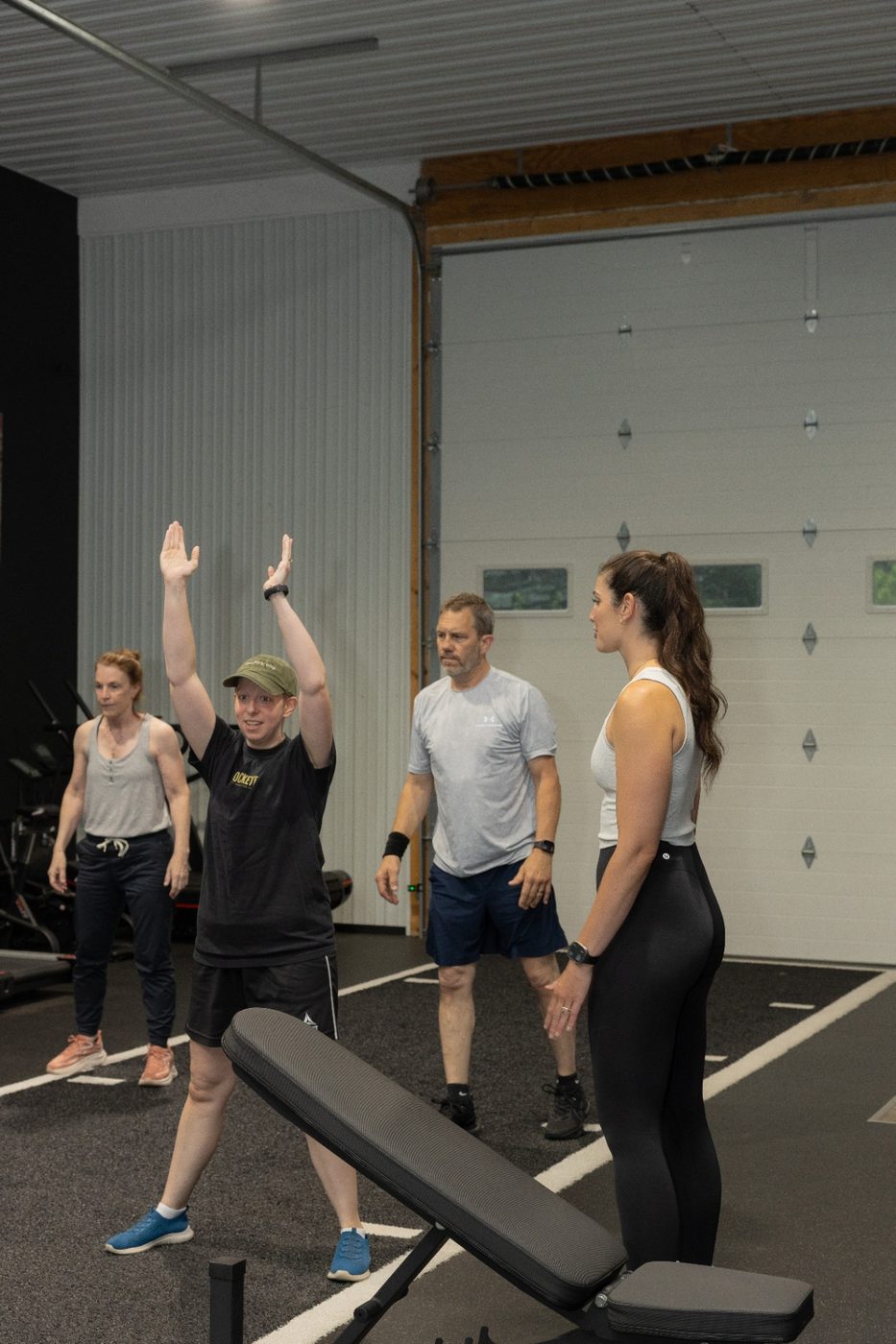 RockeyFit coach leading a small group through a mobility warm-up in Hamburg, NY